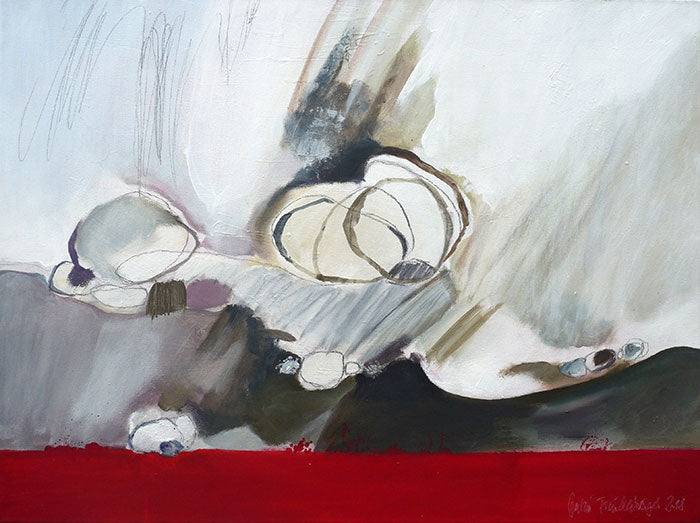 Steine an rotem Strand